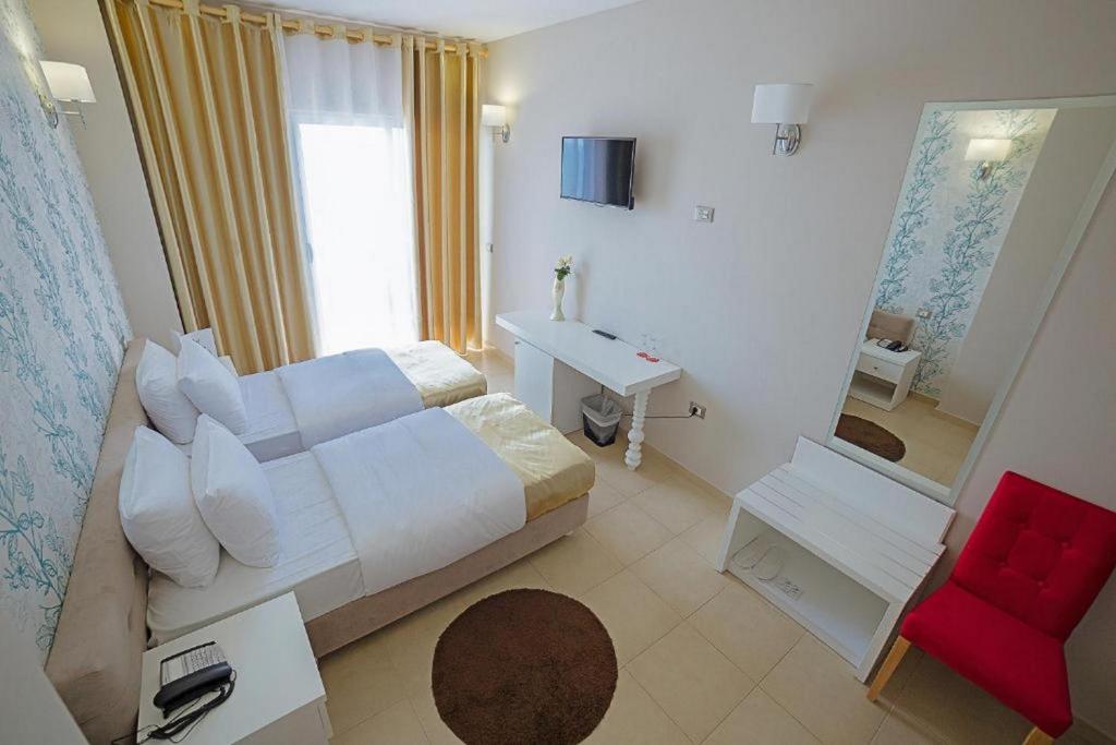 Postel nebo postele na pokoji v ubytování Sun Hotel