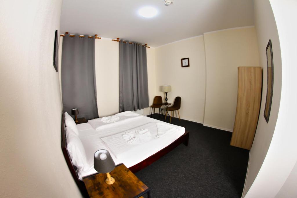 Postel nebo postele na pokoji v ubytování Hotel Karlshorst