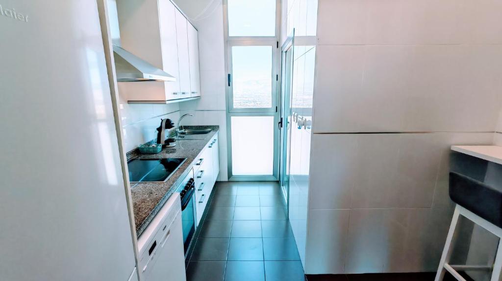 A kitchen or kitchenette at Luxury apartment on the 41st floor with stunning sea views