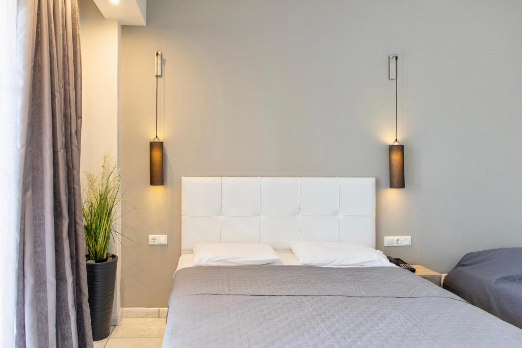 Postel nebo postele na pokoji v ubytování Anais Hotel