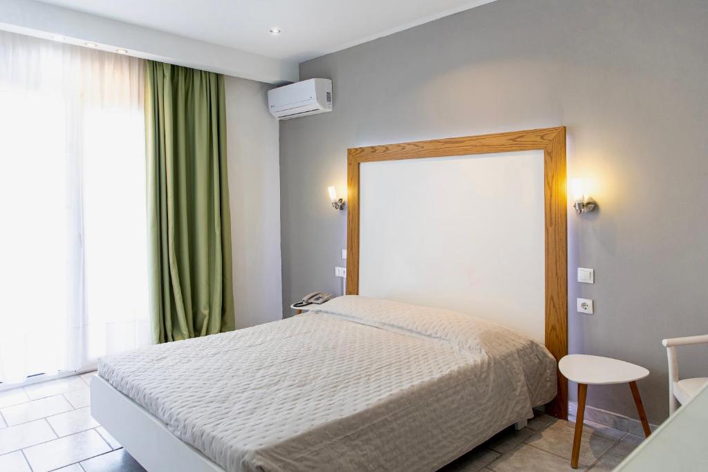 Postel nebo postele na pokoji v ubytování Anais Hotel