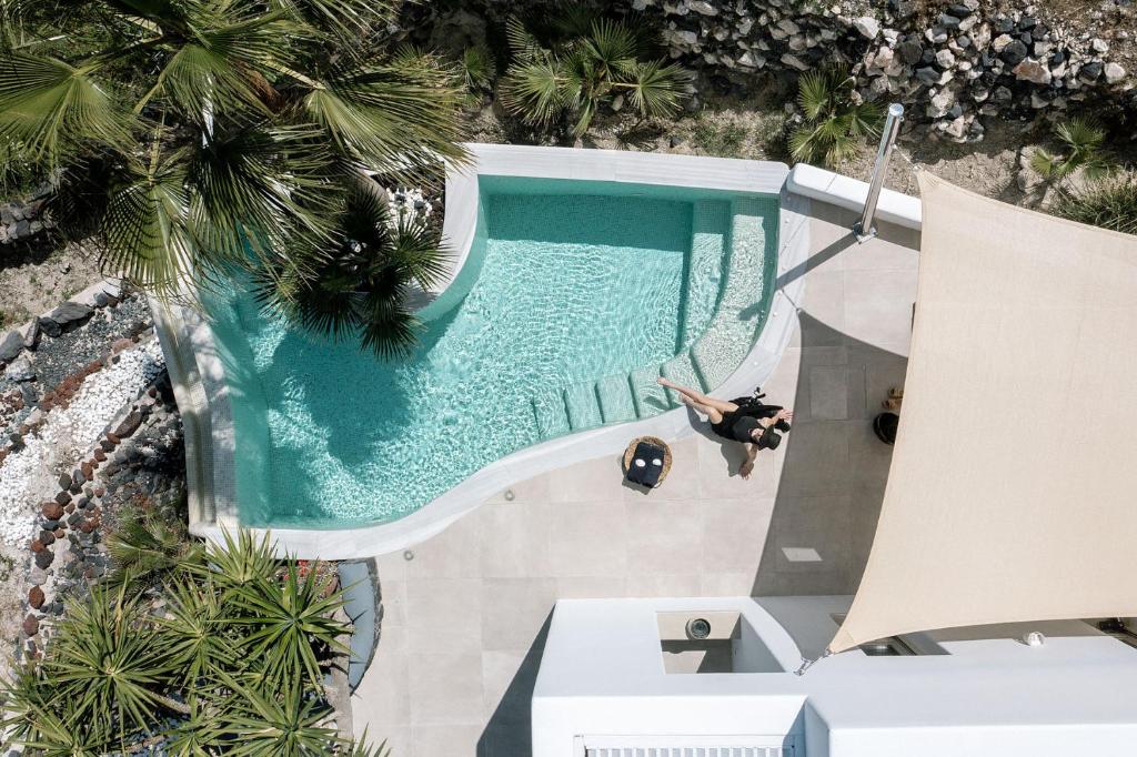 an overhead view of a swimming pool at a resort at Casa Luz in Pyrgos