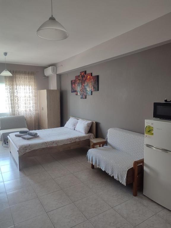 A bed or beds in a room at Marianna's apartment
