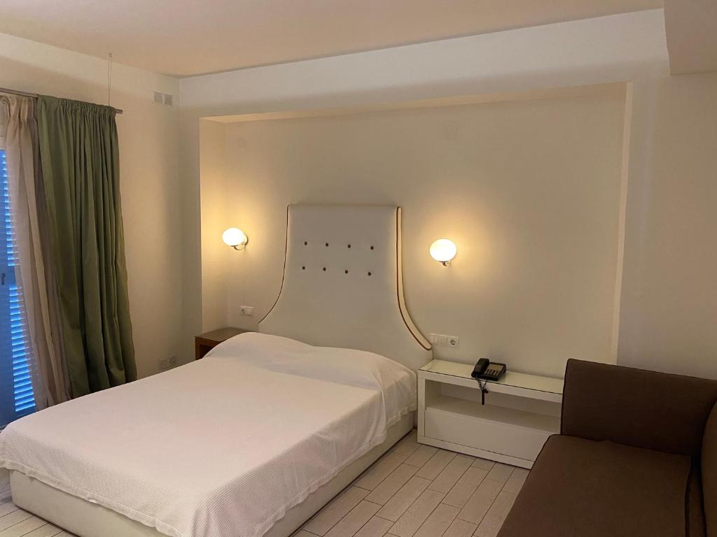 Postel nebo postele na pokoji v ubytování Anais Hotel