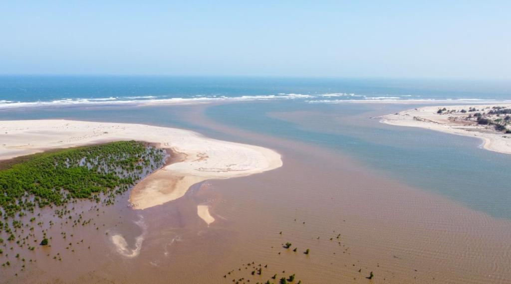 an aerial view of a beach and the ocean at Cozy 1 bedroom Coastal Condo Beachside Bliss Near Golf & Adventure in Malindi