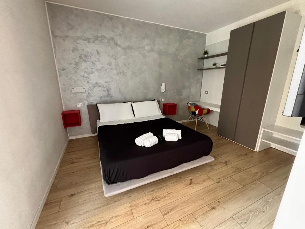Posteľ alebo postele v izbe v ubytovaní san rocco apartments