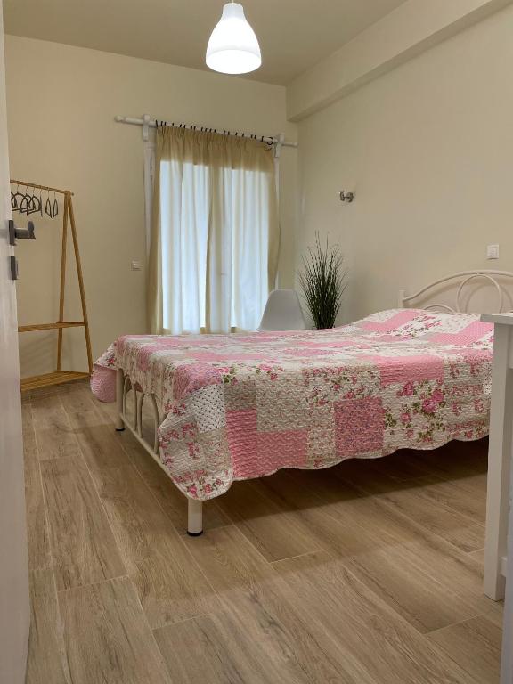 A bed or beds in a room at Kontos Mansion