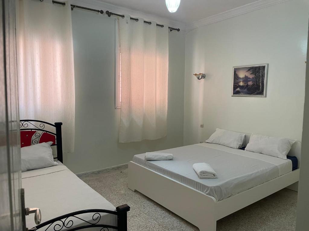 Postel nebo postele na pokoji v ubytování Hotel Maison Olga