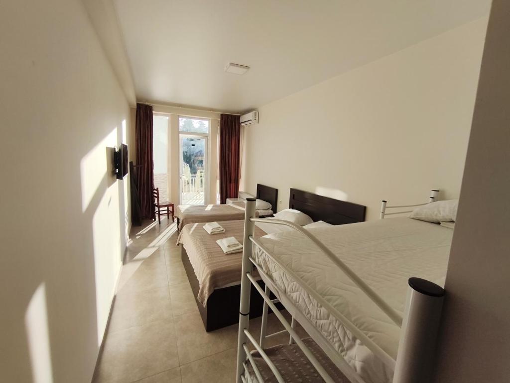 Postel nebo postele na pokoji v ubytování KARD HOUSE