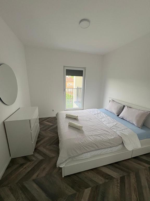 Postel nebo postele na pokoji v ubytování Tians Apartment