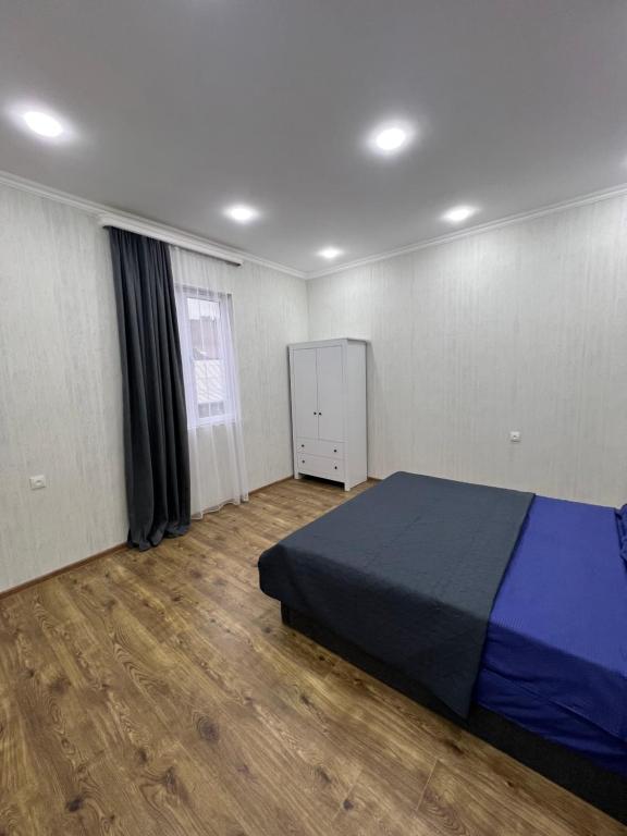 Postel nebo postele na pokoji v ubytování Home in Tiflis
