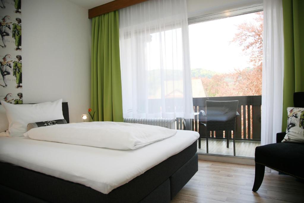 Postel nebo postele na pokoji v ubytování Hotel Pflug