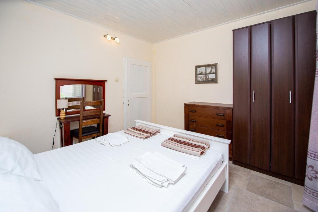 Postel nebo postele na pokoji v ubytování Apartments Kole