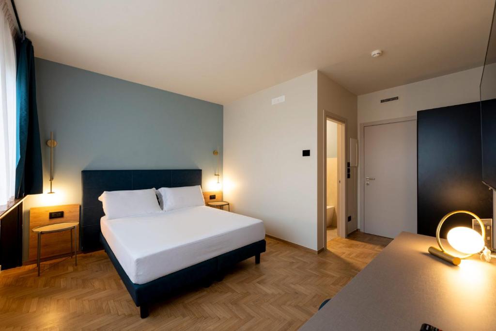 Postel nebo postele na pokoji v ubytování Cristal Palace Hotel