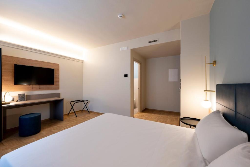 Postel nebo postele na pokoji v ubytování Cristal Palace Hotel