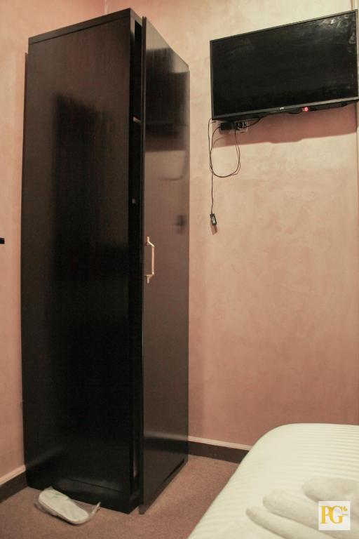 Postel nebo postele na pokoji v ubytování Cairo Paradise Hotel