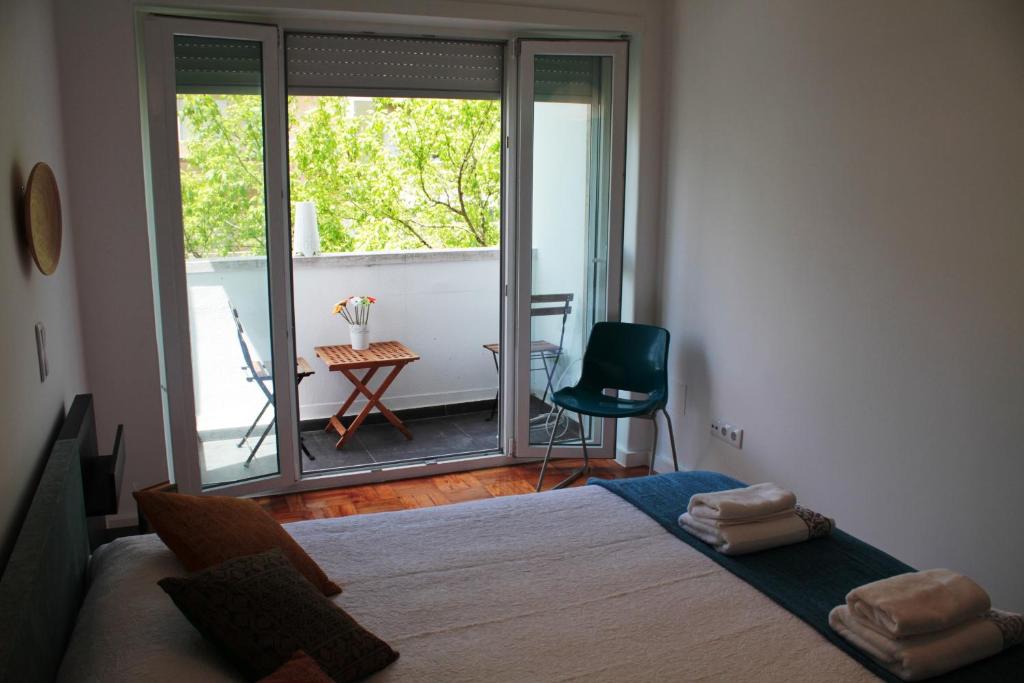 En eller flere senger på et rom på New Graça Spacious Apartment
