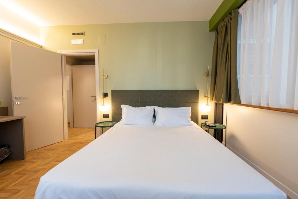 Postel nebo postele na pokoji v ubytování Cristal Palace Hotel