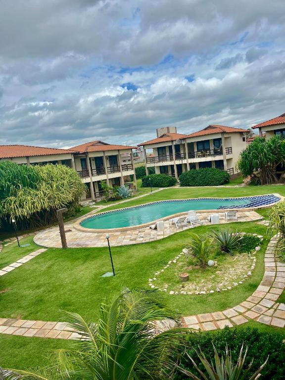 an image of a resort with a swimming pool at Ondas do Mar in Taíba