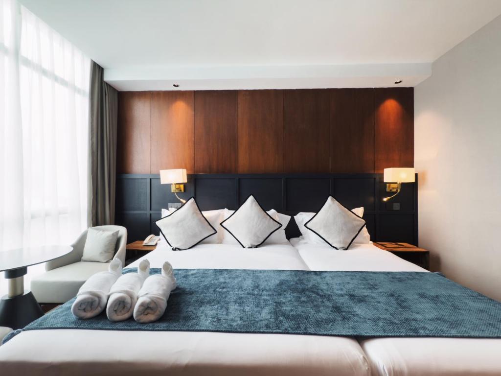 Ένα ή περισσότερα κρεβάτια σε δωμάτιο στο Moon Hotel