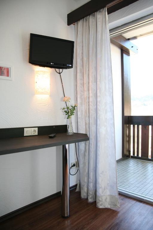 TV a/nebo společenská místnost v ubytování Hotel Pflug