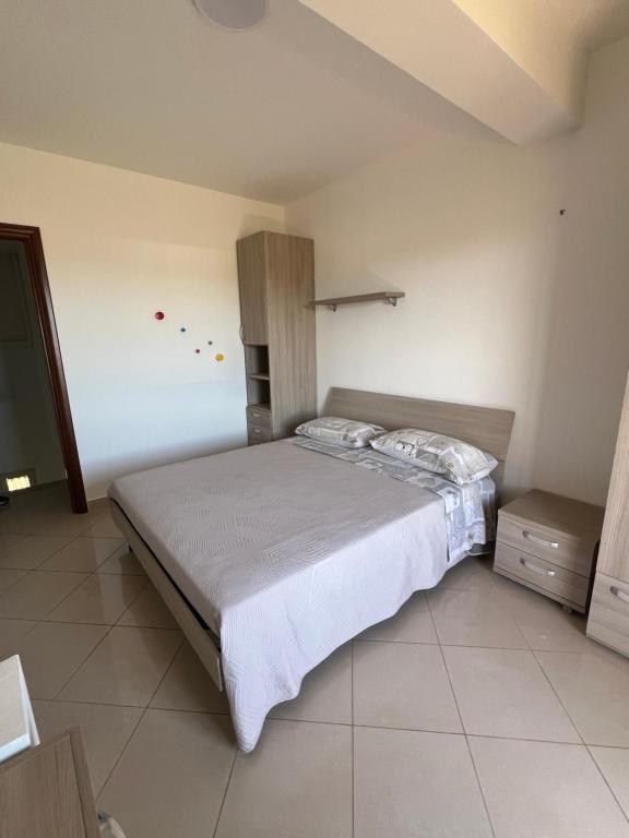 Ένα ή περισσότερα κρεβάτια σε δωμάτιο στο Villa Letizia - Sabaudia