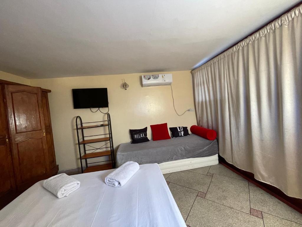 Postel nebo postele na pokoji v ubytování Hotel Maison Olga