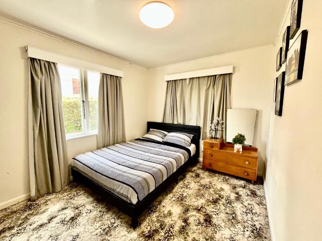 Postel nebo postele na pokoji v ubytování PRIVATE ROOMS IN CENTRAL AUCKLAND