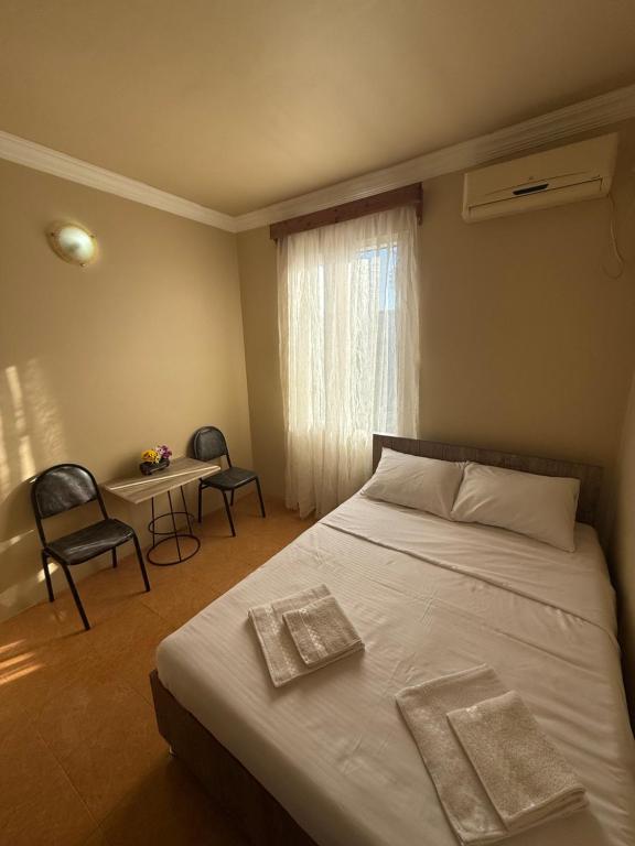 Postel nebo postele na pokoji v ubytování LUNA Hotel