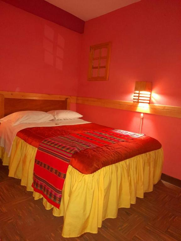 Postel nebo postele na pokoji v ubytování Jaimes Inn Hostel