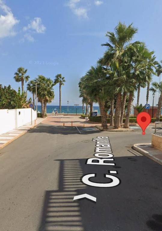 a street with a sign in the middle of the road at apartamento vacacional roquetas de mar in Roquetas de Mar
