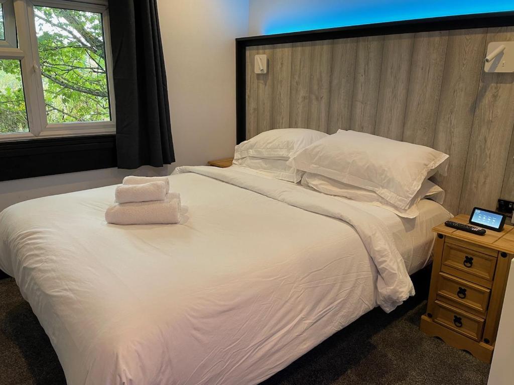 Postel nebo postele na pokoji v ubytování TheWaterfrontLodges