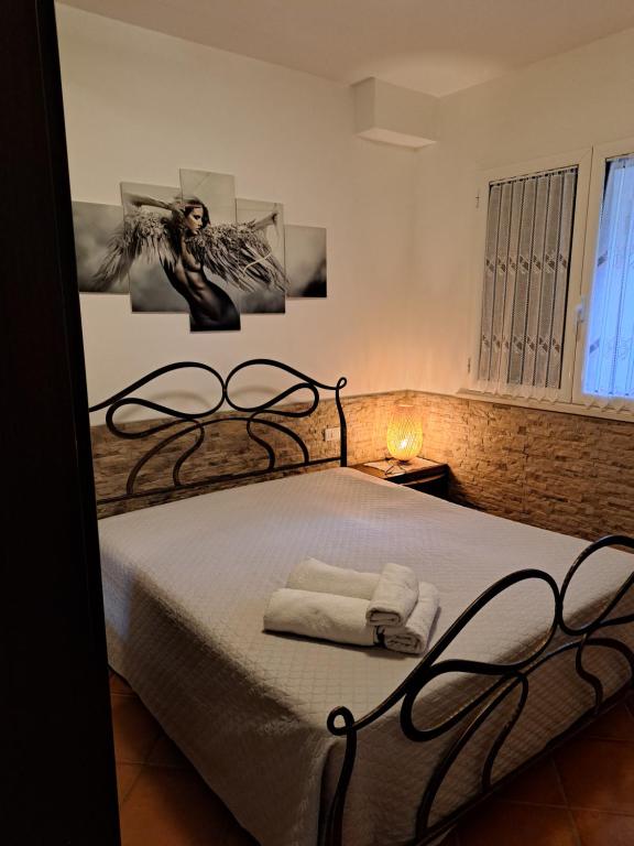 Postel nebo postele na pokoji v ubytování Complesso I Giardini Elisei