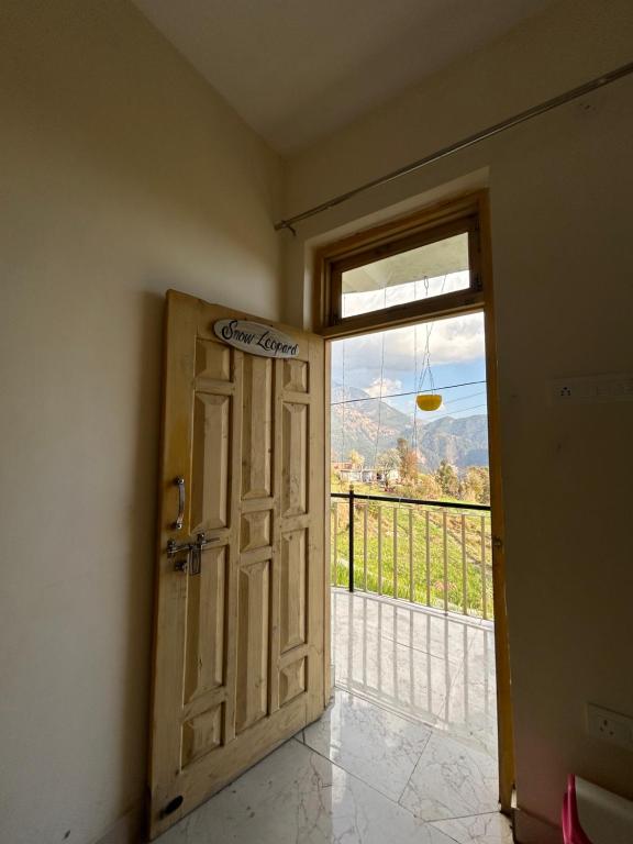 an open door to a room with a view at Kareri Dhauladhar view homestay in Dharamshala