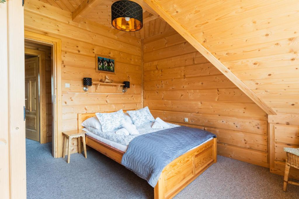 Posteľ alebo postele v izbe v ubytovaní Apartament z widokiem w Murzasichlu