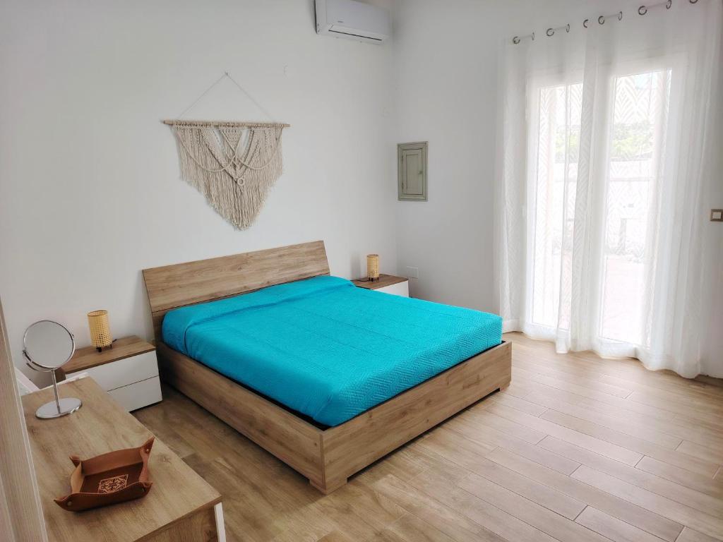 Ένα ή περισσότερα κρεβάτια σε δωμάτιο στο Pastello Bianco Apartments