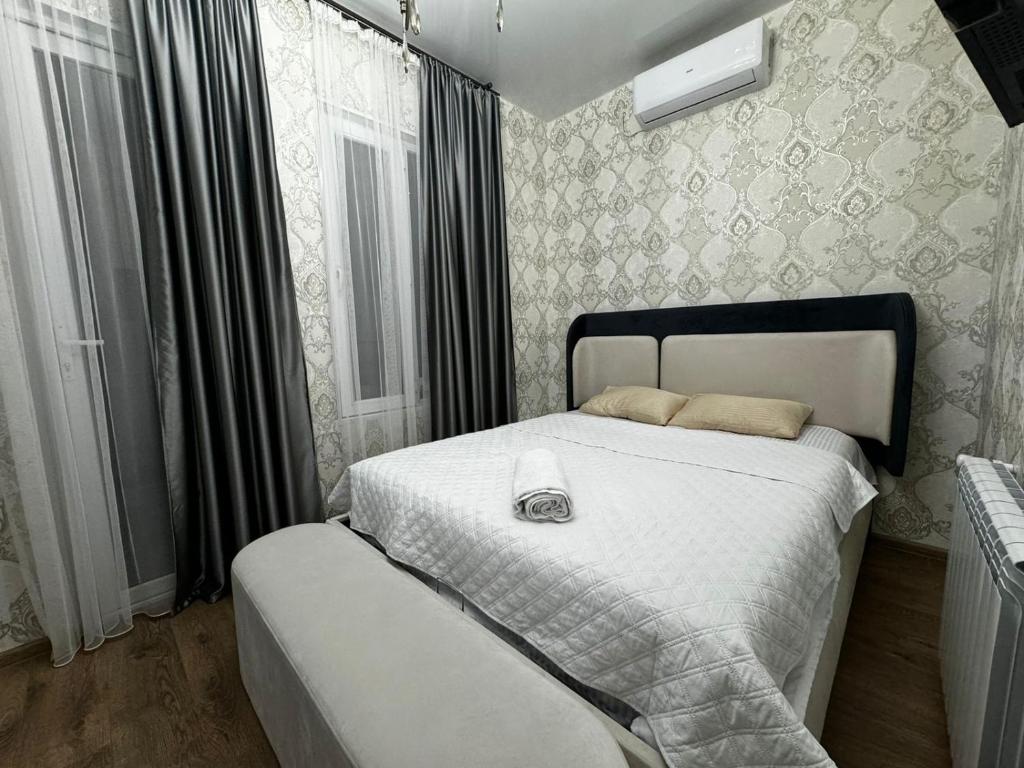 Postel nebo postele na pokoji v ubytování Kobuleti Guest House