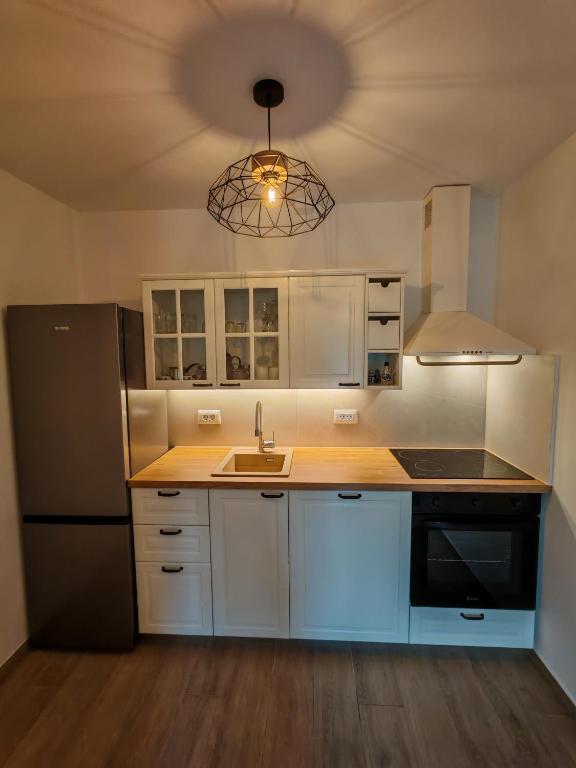 Kuchyňa alebo kuchynka v ubytovaní Apartments Amfora