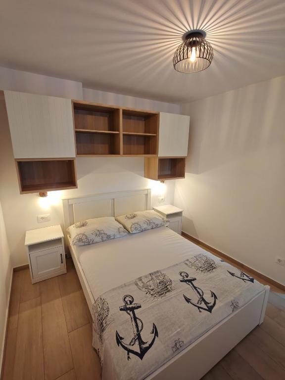 Posteľ alebo postele v izbe v ubytovaní Apartments Amfora