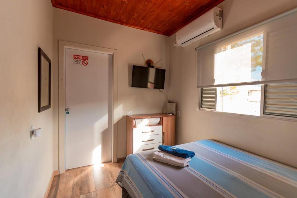 Postel nebo postele na pokoji v ubytování Flat segundo andar Confortável