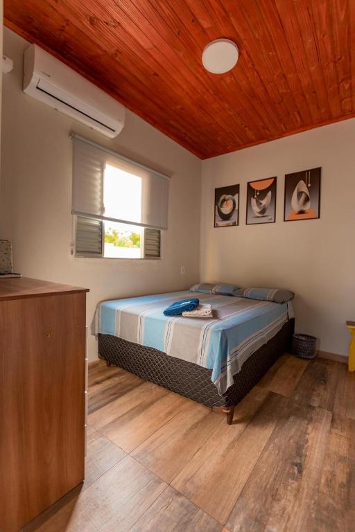 Postel nebo postele na pokoji v ubytování Flat segundo andar Confortável