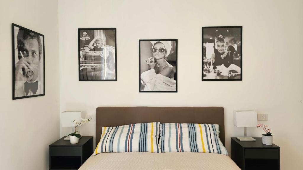 En eller flere senge i et værelse på Garda Moments Apartment