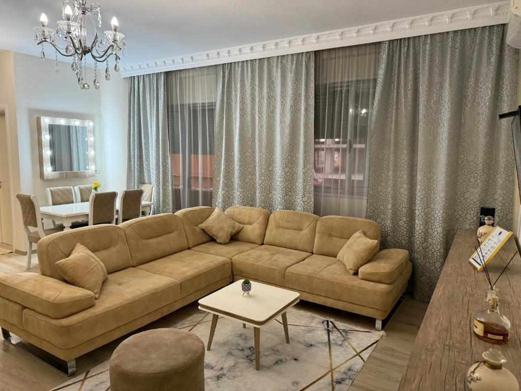 a living room with a couch and a table at Ardbay Apartment in Golem