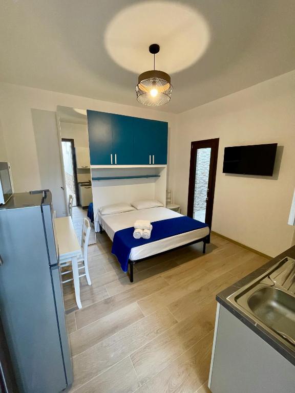 Postel nebo postele na pokoji v ubytování Sant Isidoro Apartments