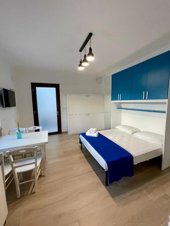 Postel nebo postele na pokoji v ubytování Sant Isidoro Apartments