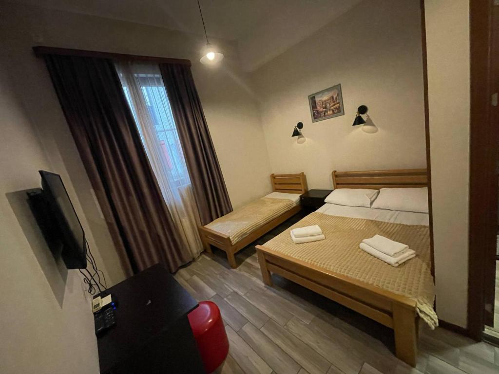 Postel nebo postele na pokoji v ubytování Guest House Lion