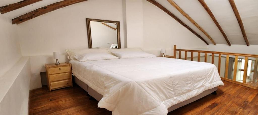 Postel nebo postele na pokoji v ubytování Loft Casa Yucay