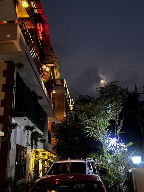 a car parked in front of a building at night at Casa Branca Retreat &Hub in Varkala