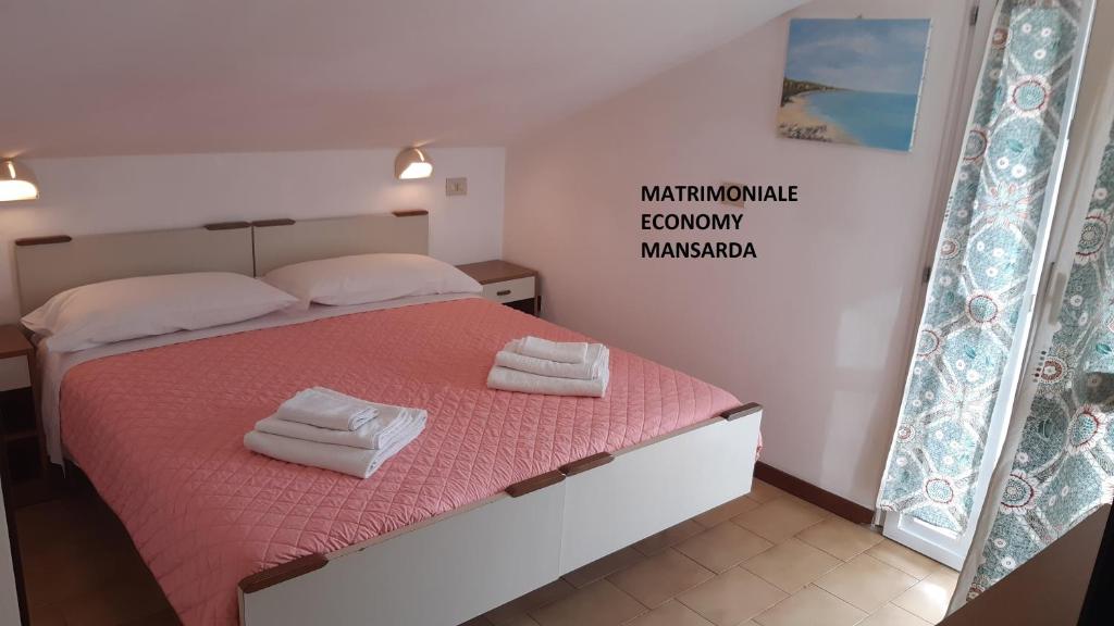 Postel nebo postele na pokoji v ubytování Hotel Elisabetta 2 stelle