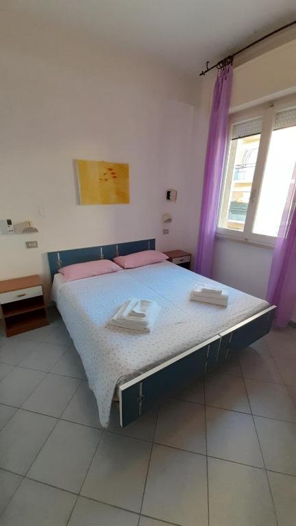 Postel nebo postele na pokoji v ubytování Hotel Elisabetta 2 stelle
